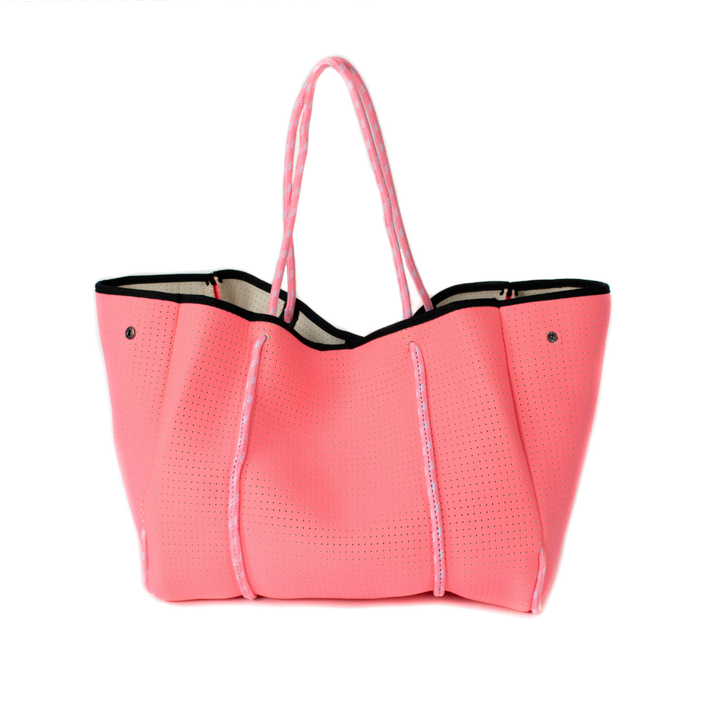 Neon pink neoprene tote bag with rope handles and black piping. 